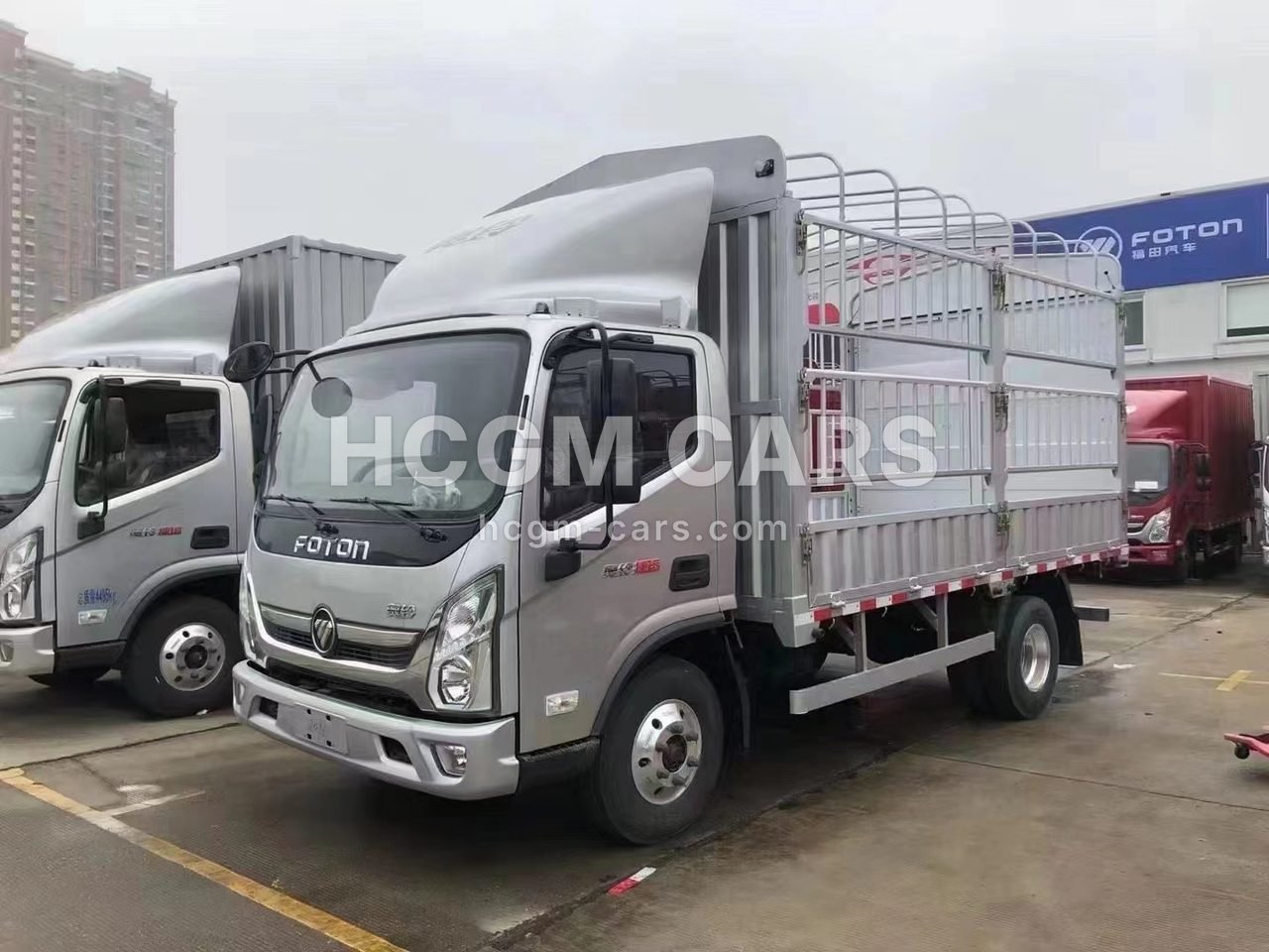 Silver Foton Aumark E 4x2 stake cargo truck, front three-quarter view